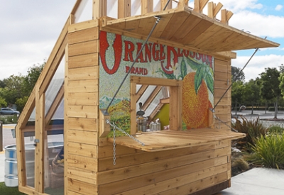 Farm to Table a wooden farmstand-inspired mini-greenhouse playhouse.