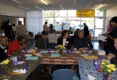 Group of people judging a cooking contest at Armstrong Place Senior in San Francisco.