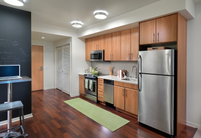 Interior view of a kitchen inside a unit at Rincon Green in San Francisco.