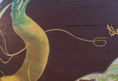 Close-up of the large sunflower mural at Station Center Family Housing in Union City, Ca.