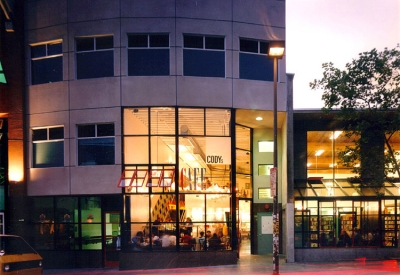 Exterior street view of  Fred Cody Building & Cody's Cafe at dusk in Berkeley, California.