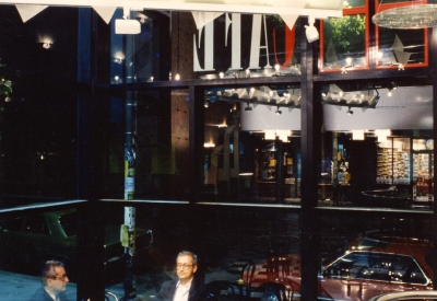 Seating area with hanging light fixtures inside  Fred Cody Building & Cody's Cafe in Berkeley, California.