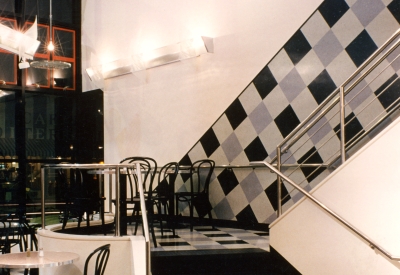 Checkered vinyl wall and floor detail at  Fred Cody Building & Cody's Cafe in Berkeley, California.