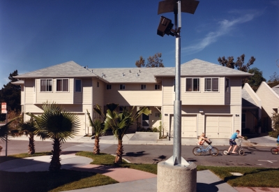Exterior street view of two duplexs at Meadow Court in San Mateo, California.