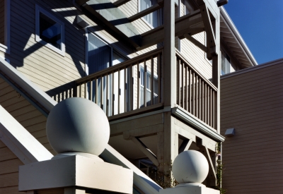 Exterior view of an entry stair and balcony at Meadow Court in San Mateo, California.