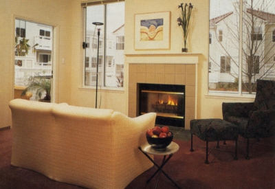 Interior unit living room with fireplace at Parkview Commons in San Francisco.