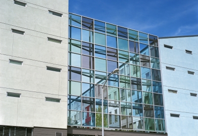 Exterior view of the glass sound wall at 888 Seventh Street in San Francisco.
