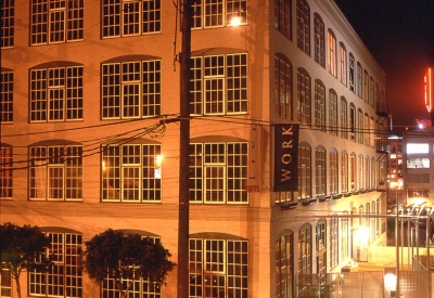 Exterior view of 355 Bryant Lofts in San Francisco at night.