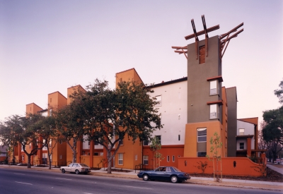 Exterior street view of Plaza Maria at sunset in San Jose, California.