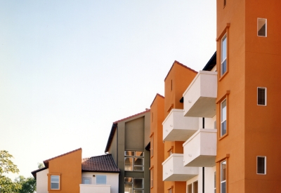 Exterior view of the units with tucked under garages at Plaza Maria in San Jose, California.