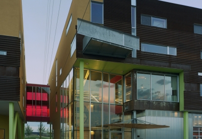 Exterior view of the entrance to Taxi 2 at dusk in Denver, Colorado. 