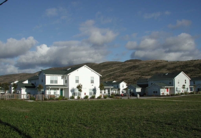 View of the grass area with Moonridge Village in Santa Cruz, California in the background.