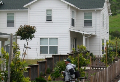 Resident walking with his bicycle at Moonridge Village in Santa Cruz, California.