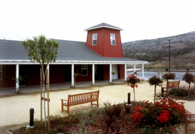 Courtyard with benches in front of the community building Moonridge Village in Santa Cruz, California.