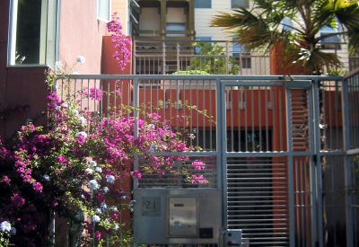 Entry courtyard metal gate at Columbia Park in San Francisco. 