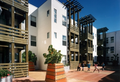 Children playing in the courtyard at Columbia Park in San Francisco. 