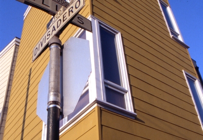 Detail view of the street signs, Ellis and Divisadero with Bell Mews in the background.
