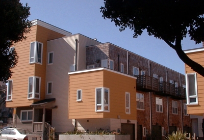 Exterior street view of courtyard, mews, and balconies at Bell Mews in San Francisco. 