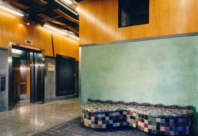 Interior view of the form lobby with a mosaic tile bench.