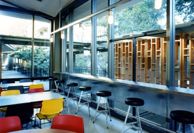 Interior view of U.C. Berkeley Dining Halls with counter and table seating.