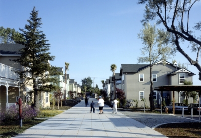 People walking down the pedestrian path at Oroysom Village in Fremont, California.