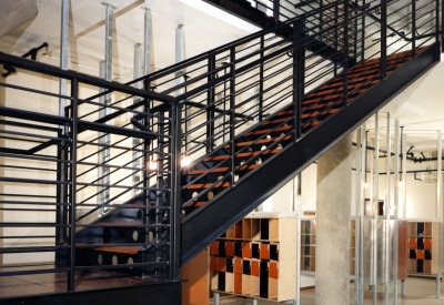 Lobby with stairs and mailboxes at  1500 Park Avenue Lofts in Emeryville, California.