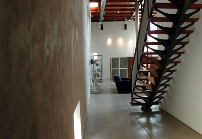 Stairs up to the office loft at 310 Waverly Residence in Palo Alto, California.