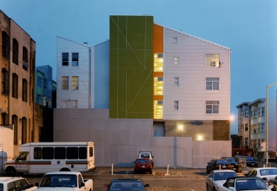 Exterior view of SOMA Residences in San Francisco at dusk.