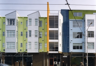 Exterior elevation with retail spaces at SOMA Residences in San Francisco.