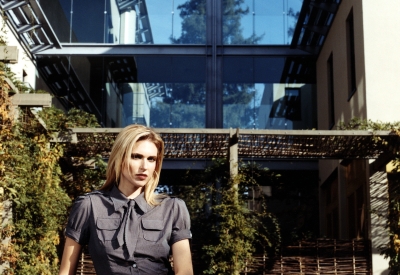 Woman sitting in the courtyard at Hotel Healdsburg in Healdsburg, Ca.