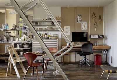 Interior view of the kitchen, dining area, and work space inside Zero Cottage in San Francisco.