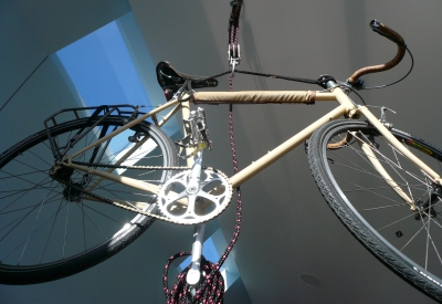 A bike hanging from the ceiling at Shotwell Design Lab in San Francisco.