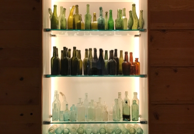 Reclaimed glass bottles on display at 855 Brannan in San Francisco.