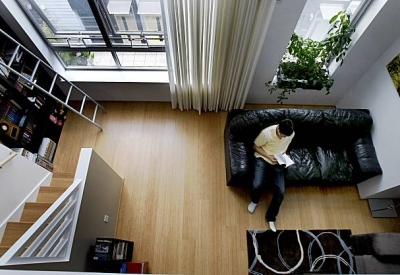 Looking down from a loft interior into the living room at Pacific Cannery Lofts in Oakland, California.