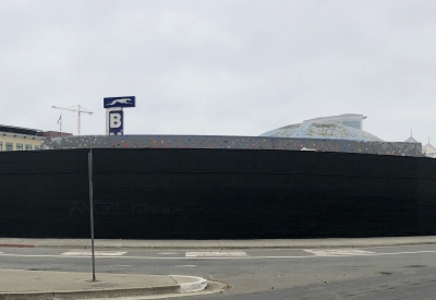 Exterior street view of the side of David Baker Architects Office painted black ready for street art in Oakland, California.