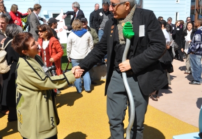 David Baker shaking hands with Cynthia Parker at the grand opening of Ironhorse at Central Station in Oakland, California.