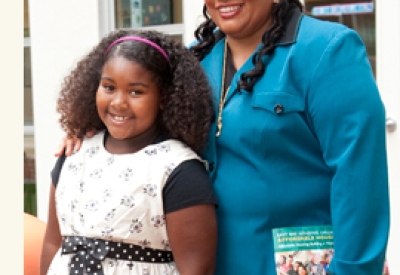 Resident and her daughter at the grand opening of Station Center Family Housing in Union City, Ca