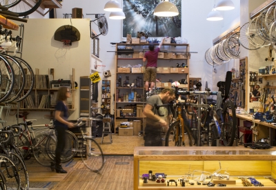 Interior view of bicycles hanging inside Huckleberry Bicycles in San Francisco.