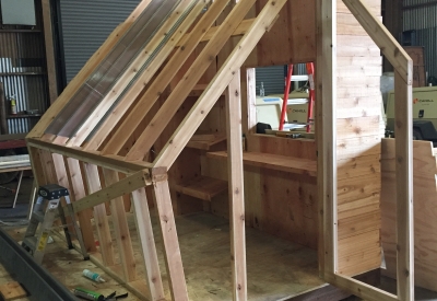 Progress shot of that Farm to Table a wooden farmstand-inspired mini-greenhouse playhouse.