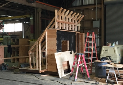 Progress building of Farm to Table a wooden farmstand-inspired mini-greenhouse playhouse