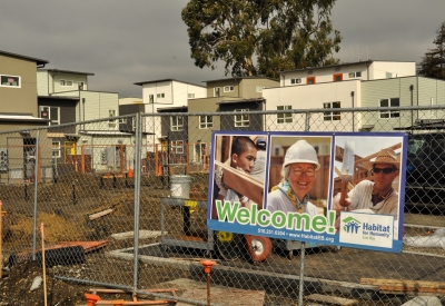 Construction site and signage for Kinsell Commons, on-site Habitat for Humanity townhouses at Tassafaronga Village in East Oakland, CA. 
