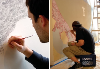 Artists painting the mural in the lobby of 200 Second Street in Oakland, California.