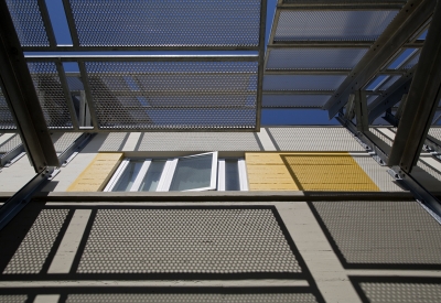 Looking up at the supportive housing units at Tassafaronga Village in East Oakland, CA. 