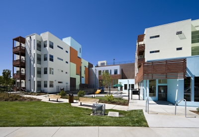 Open community space and small play area at Paseo Senter in San Jose, California.