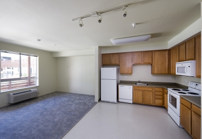 Kitchen and living room interior at Paseo Senter in San Jose, California.