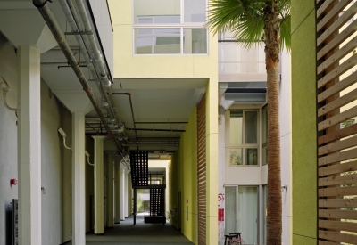 Open-air ground floor hallway at Pacific Cannery Lofts in Oakland, California.