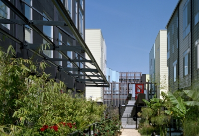 Resident path with greenery at Pacific Cannery Lofts in Oakland, California.
