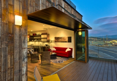 Looking into the living room from the balcony of Truckee Prototype Mixed-Use Townhouse in Truckee, California.