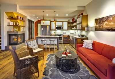 Interior view of living room and kitchen at Truckee Prototype Mixed-Use Townhouse in Truckee, California.