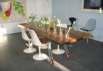 Large dining room table with flowers at  Shotwell Design Lab in San Francisco.